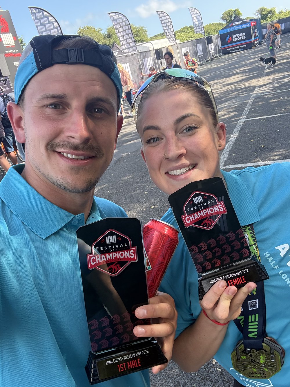 Two PACE athletes celebrating with their trophies after a race weekend