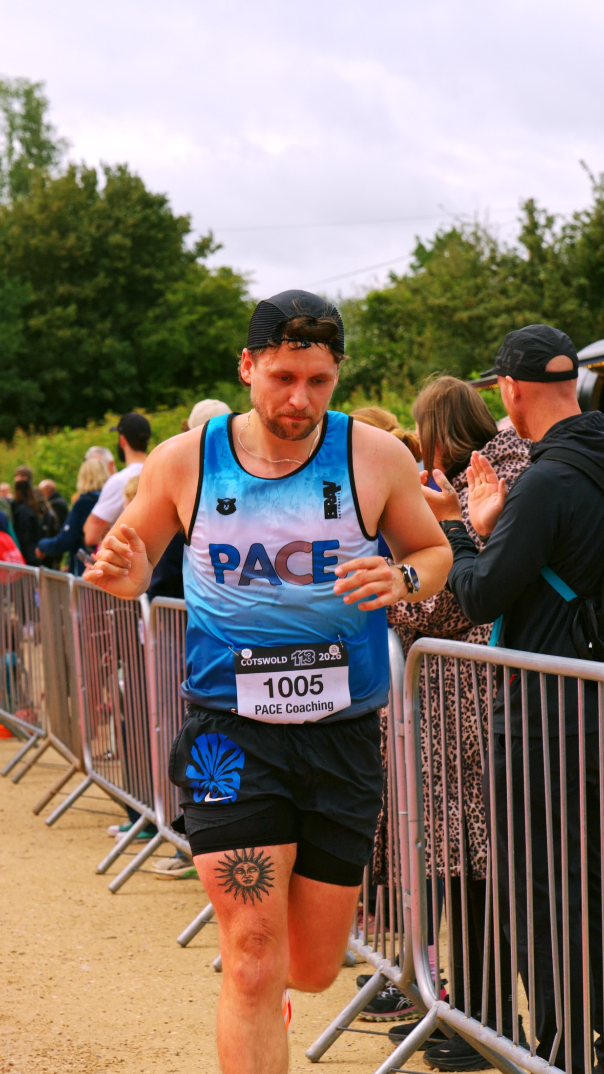 PACE athlete running past cheering supporters