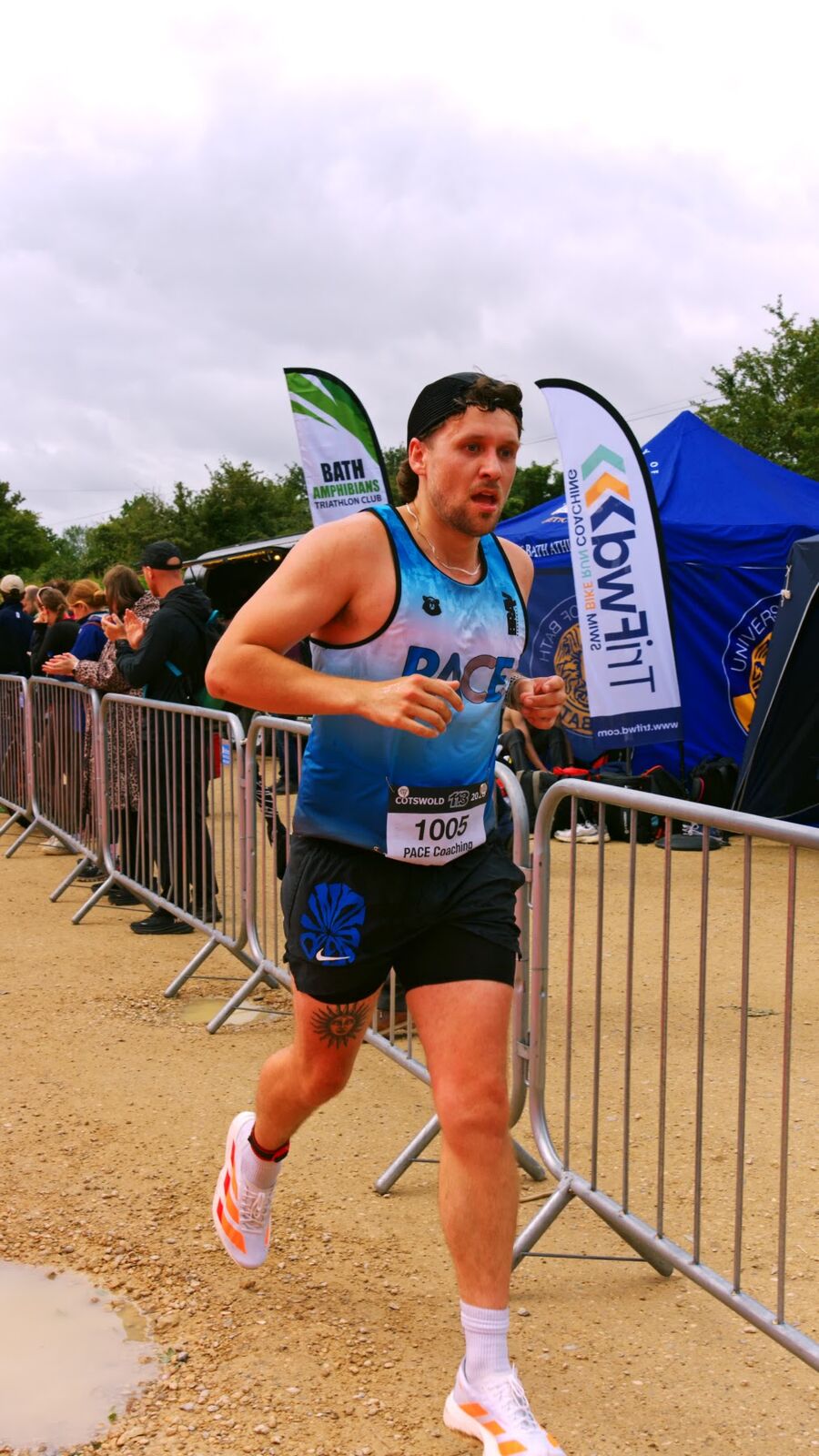 PACE athlete running in club vest