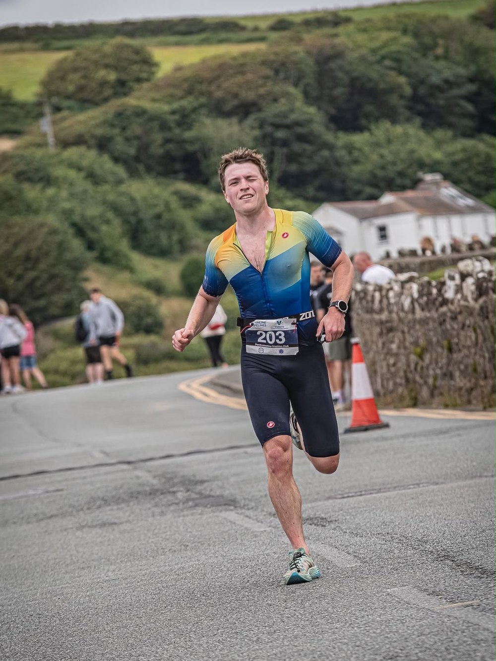 PACE athlete running hard on the run leg of a road race
